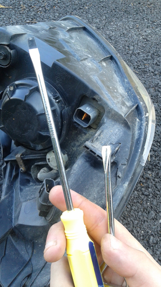 3:30pm - Break out the implements of prying to remove the connector from the old headlight assembly and discover yet MORE damage to it you didnât know about...man this thing was beat!